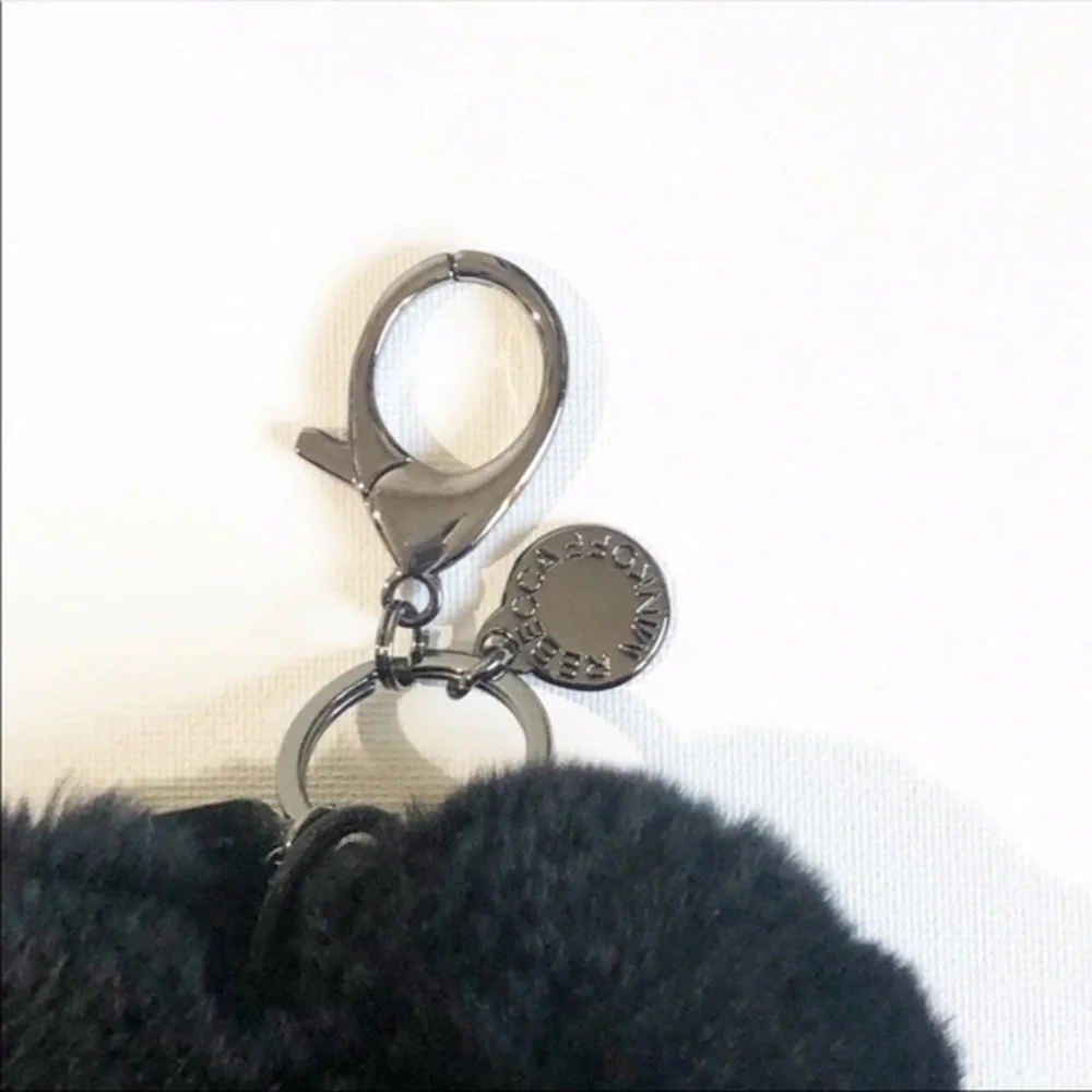 Rebecca Minkoff Fur Heart Power Puff Phone Charger & Keychain